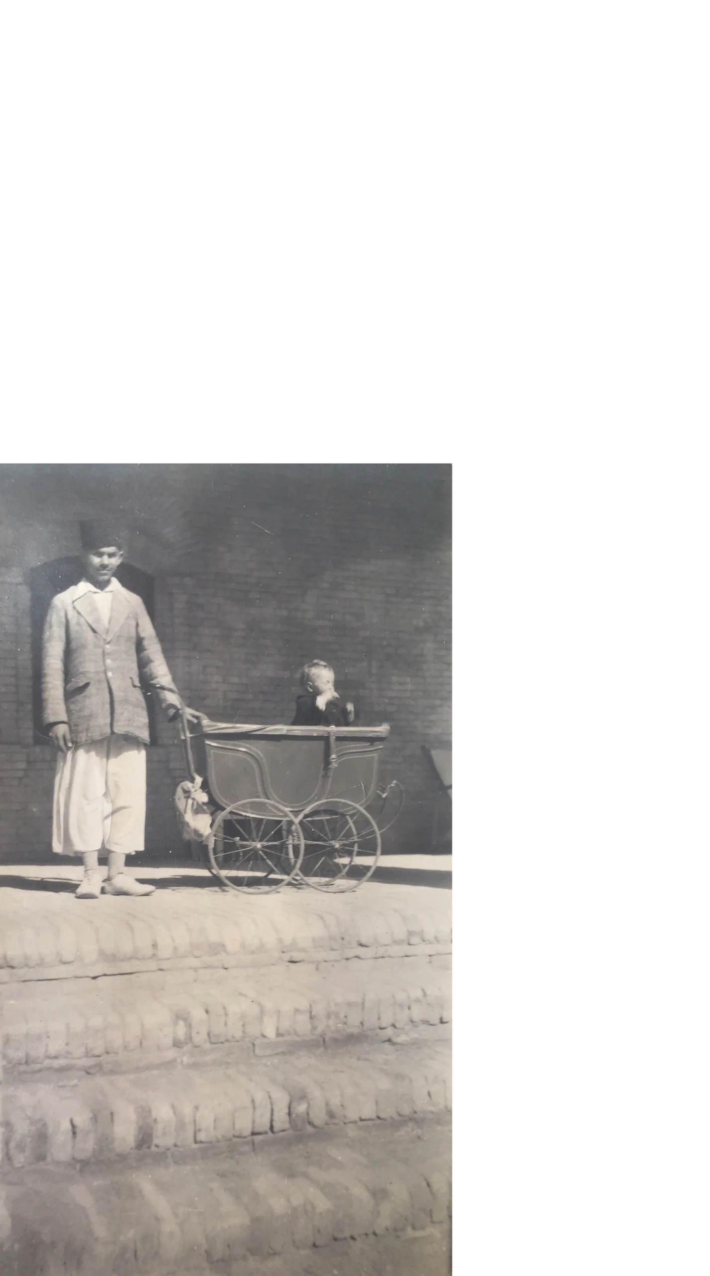 Woman with baby carriage, 1940s
